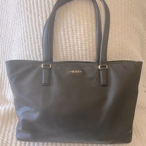 Tumi Monika Tote black leather w/ gold accents